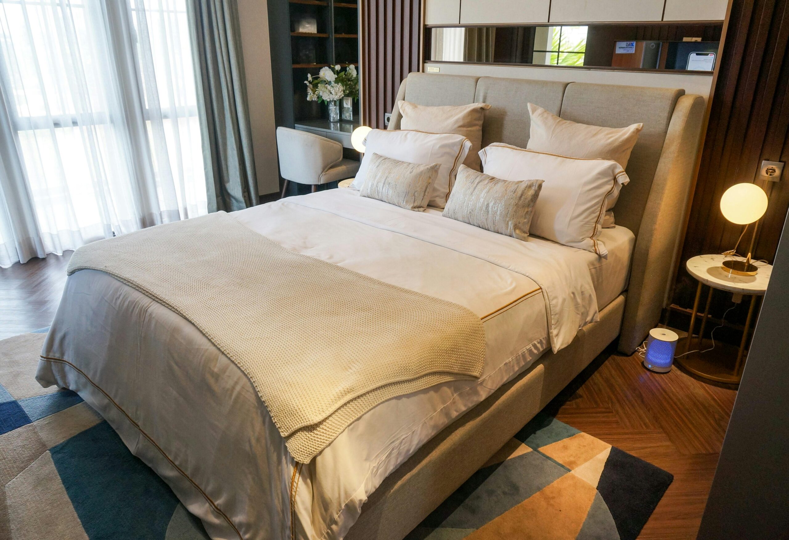 Cozy and elegant modern bedroom interior with neutral tones and stylish decor.